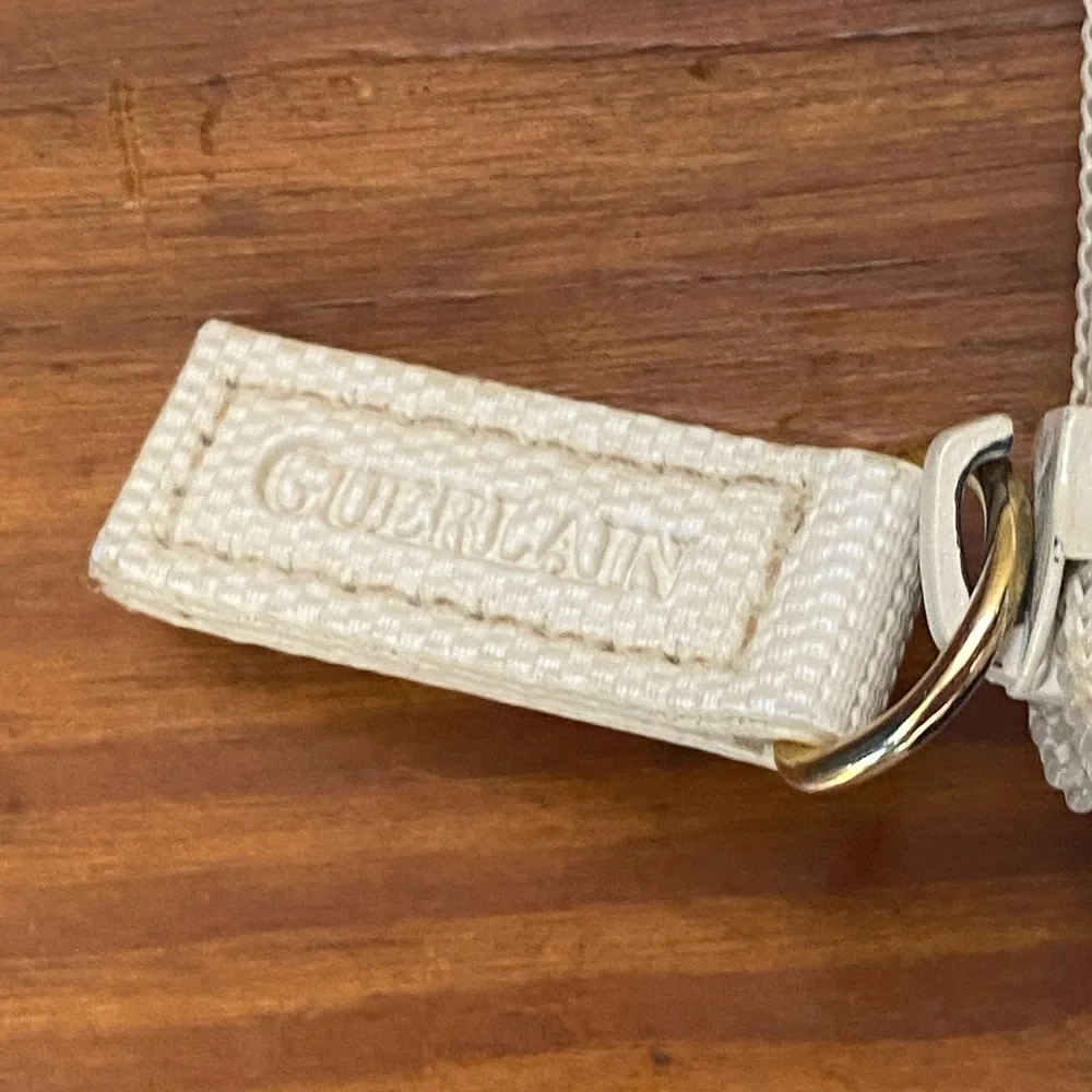 GUERLAIN Elegant Cream Cosmetic Bag with Blue Accents
